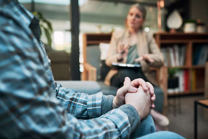 Cropped shot of a man having a therapeutic session with a psychologist