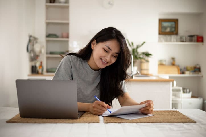 Woman looking at planner.