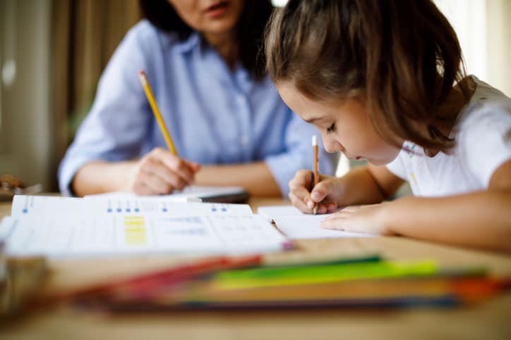 Mom talking to daughter about schoolwork